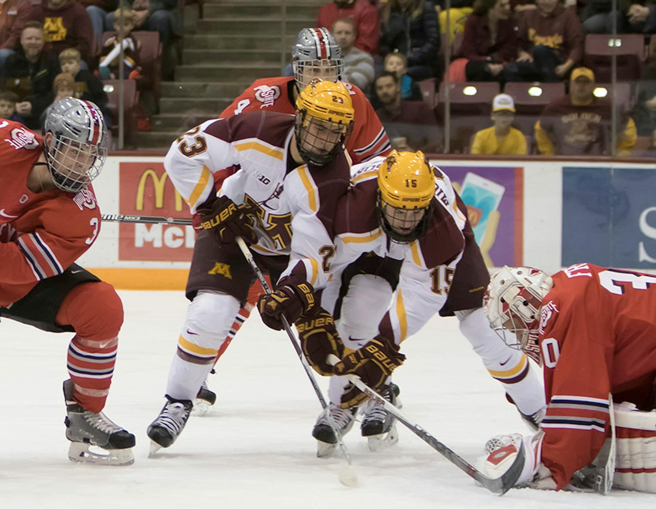 Minnesota Golden Gophers forward Jack Ramsey (16), Minnesota Golden Gophers forward Ryan Norman (23), and Minnesota Golden Gophers forward A.J. Michaelson (15) crash the net after Ohio State Buckeyes goalie Christian Frey (30) makes the save, Ohio State Buckeyes defenseman Sasha Larocque (3) and Ohio State Buckeyes defenseman Drew Brevig (4) defending as the Minnesota Golden Gophers hosted the Ohio State Buckeyes to open the Big Ten Conference schedule on December 4, 2015. ] Special to Star Trib