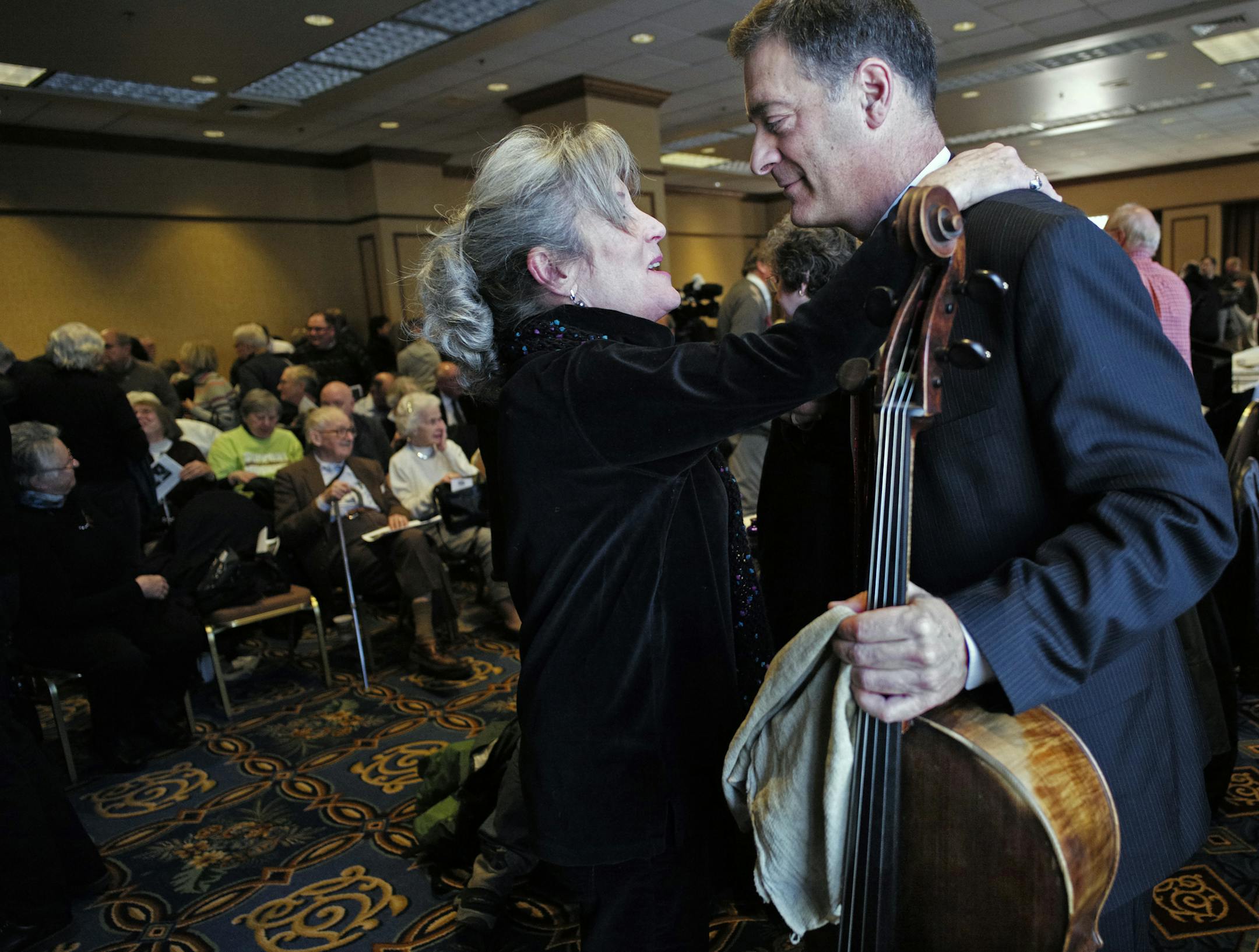At the Hilton Hotel in downtown Minneapolis, Minnesota Orchestra violinist Laurel Green gave cellist Anthony Ross a big hug after he performed for the audience, which included supporters. "I thought this was an incredibly powerful event," said Green. ]richard tsong-taatarii/rtsong-taatarii@startribune.com