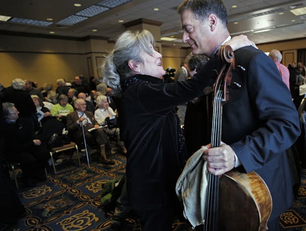 At the Hilton Hotel in downtown Minneapolis, Minnesota Orchestra violinist Laurel Green gave cellist Anthony Ross a big hug after he performed for the