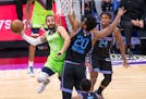 Timberwolves guard Ricky Rubio is defended by Sacramento Kings center Hassan Whiteside during the first quarter