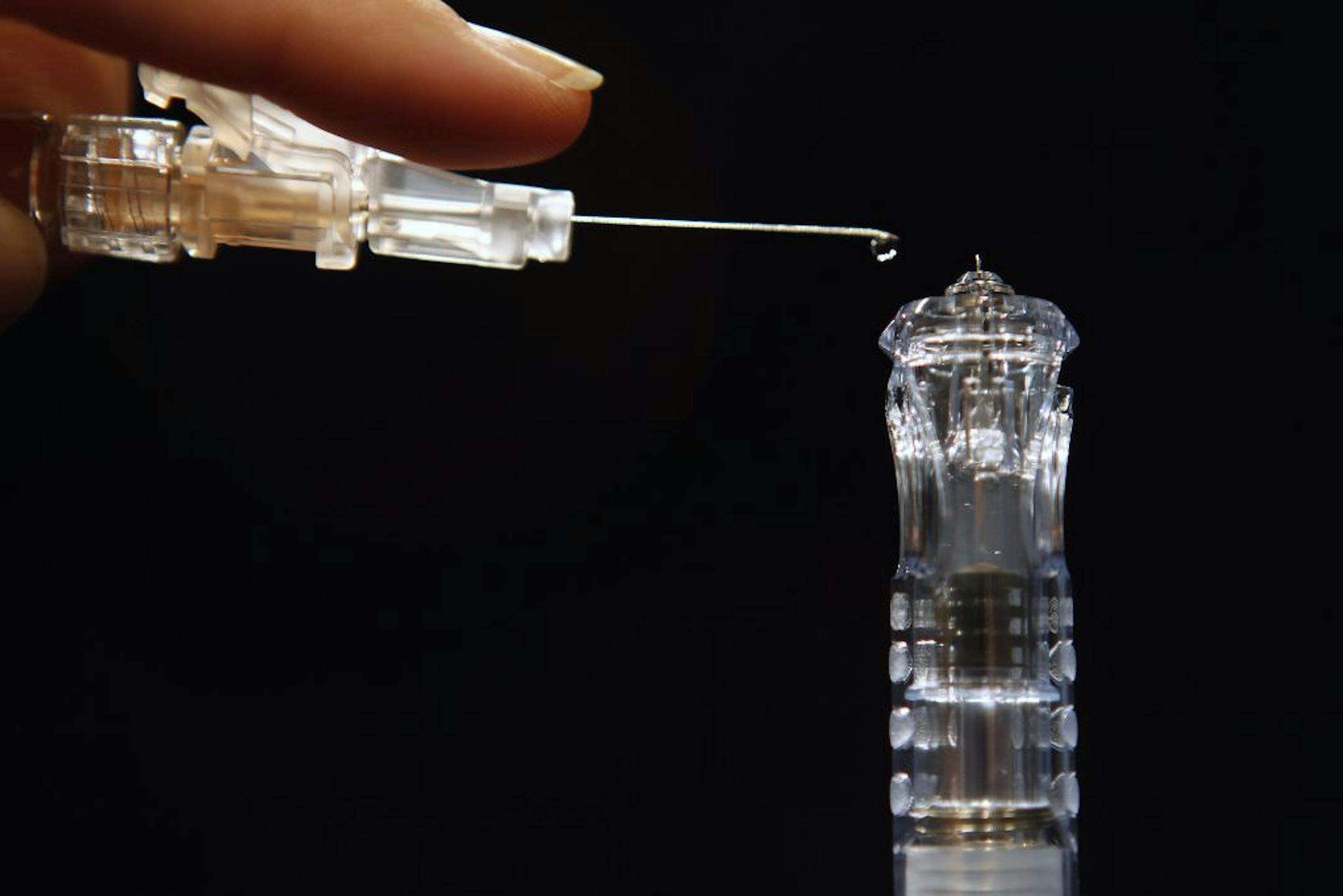 The new needle is about as long as a single drop of fluid.