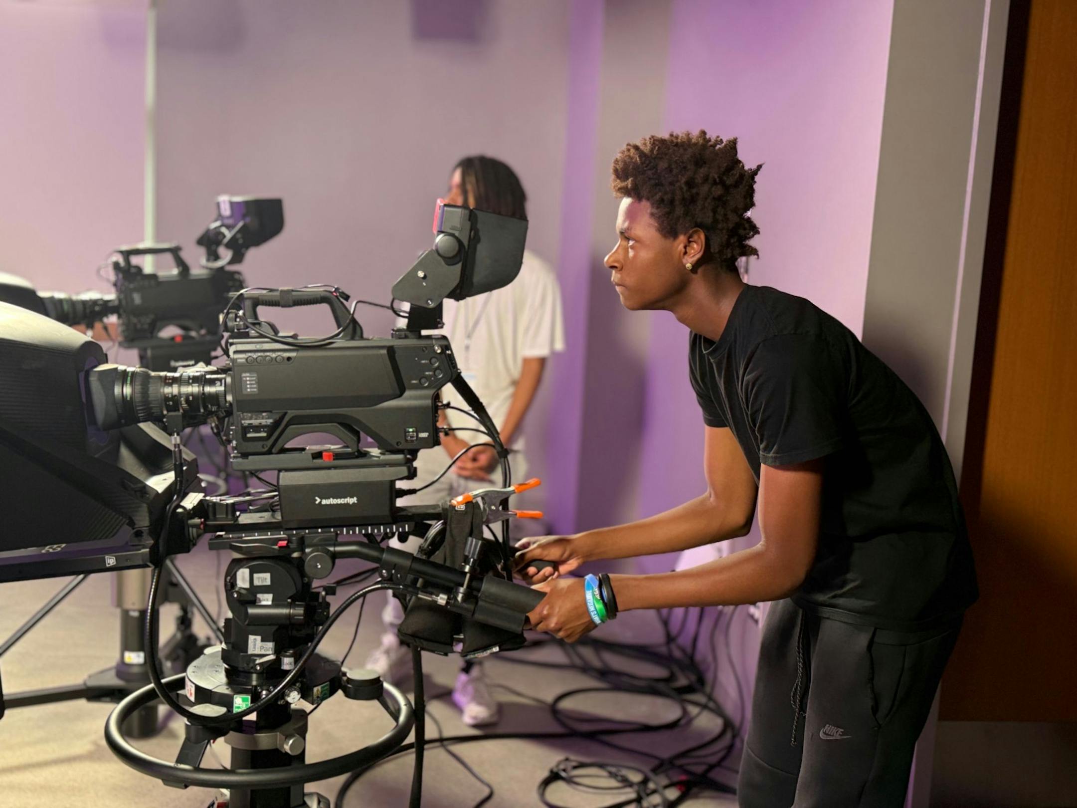 A student films content at ThreeSixty Journalism’s Multimedia Storytelling Institute