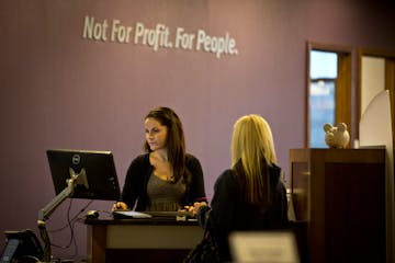 Laura Salciccia helped a customer with a transaction at Affinity Plus Federal Credit Union in Roseville in 2012.