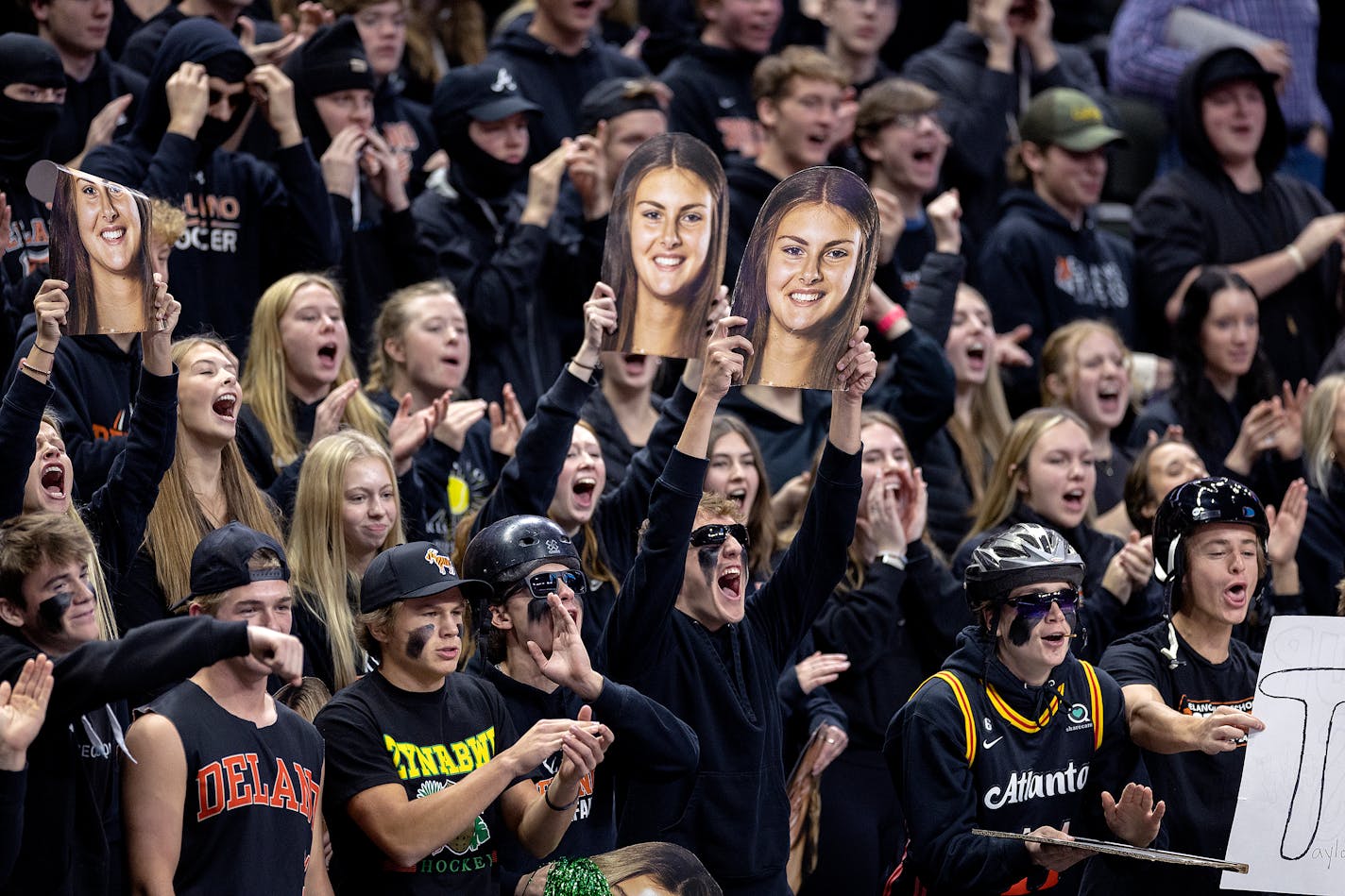 The Delano student section cheers for their team during the girls volleyball 3A semifinal match between Delano and Byron at the Xcel Energy Center, in St. Paul, Minn., on Friday, Nov. 10, 2023. ] Elizabeth Flores • liz.flores@startribune.com