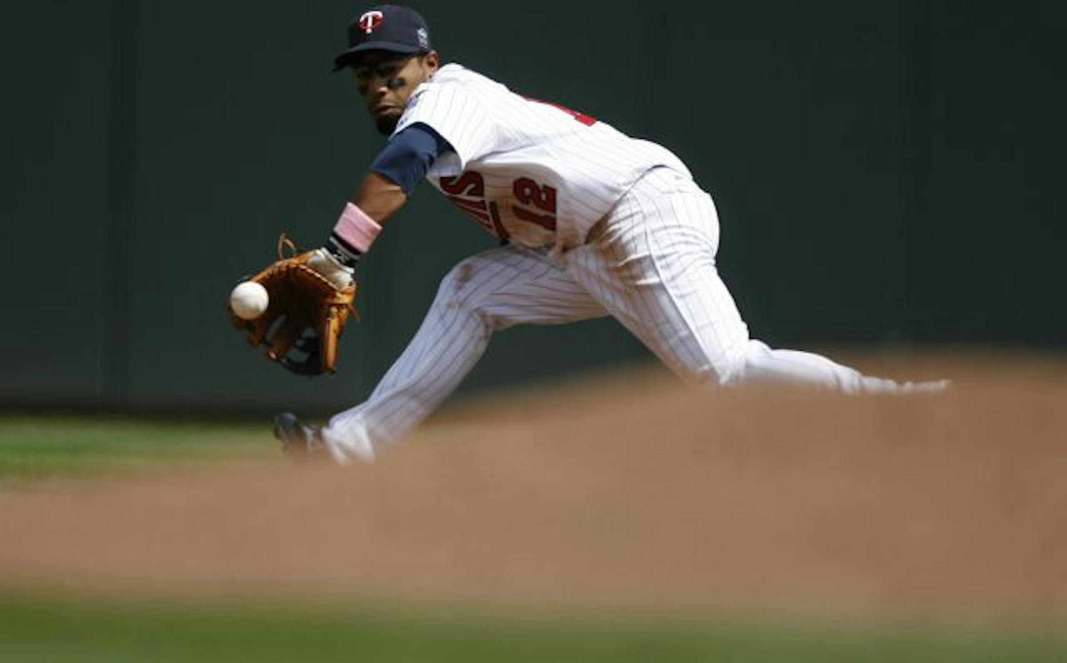 Twins second baseman Alexi Casilla contributed in the field in the seventh inning and at bat the entire game.