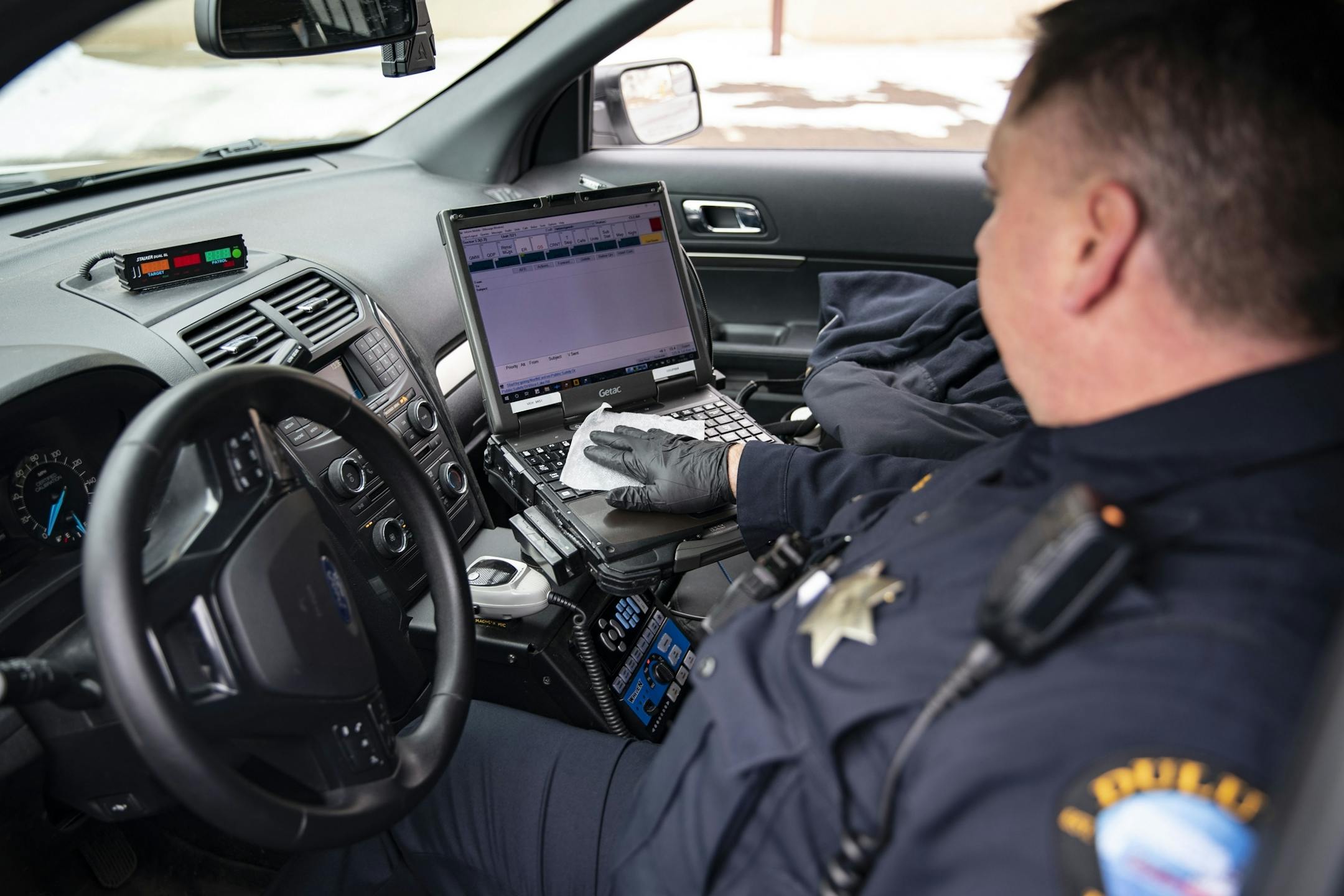 Duluth police sergeant Steven Ring disinfected his squad car after his shift on Thursday.