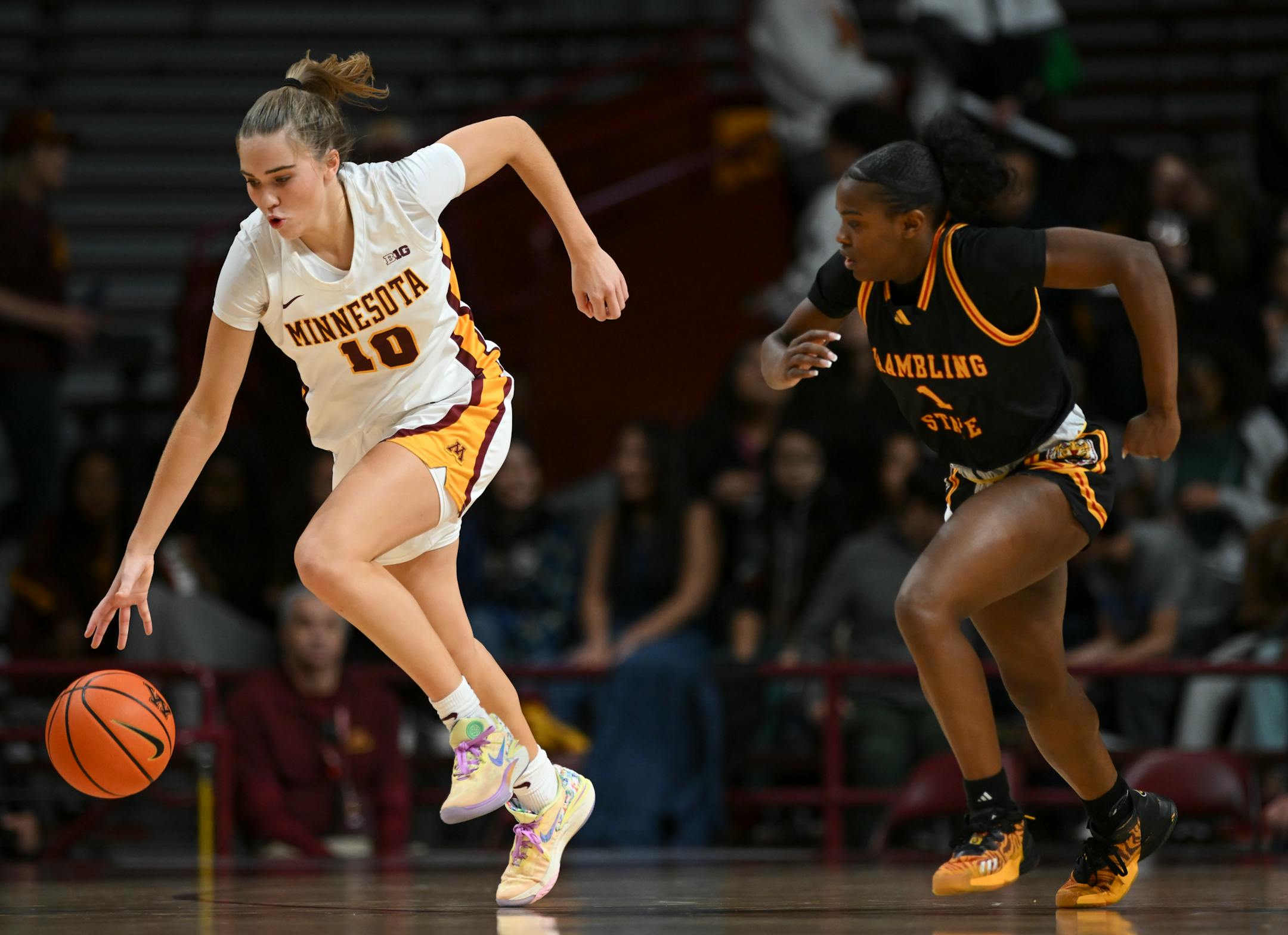 Minnesota Gophers guard Mara Braun (10) controls the ball in the second half against Grambling Lady Tigers guard Douthshine Prien (1).