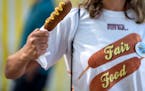 A corndog fan posed with a meal that matched her shirt at the 2019 Minnesota State Fair.