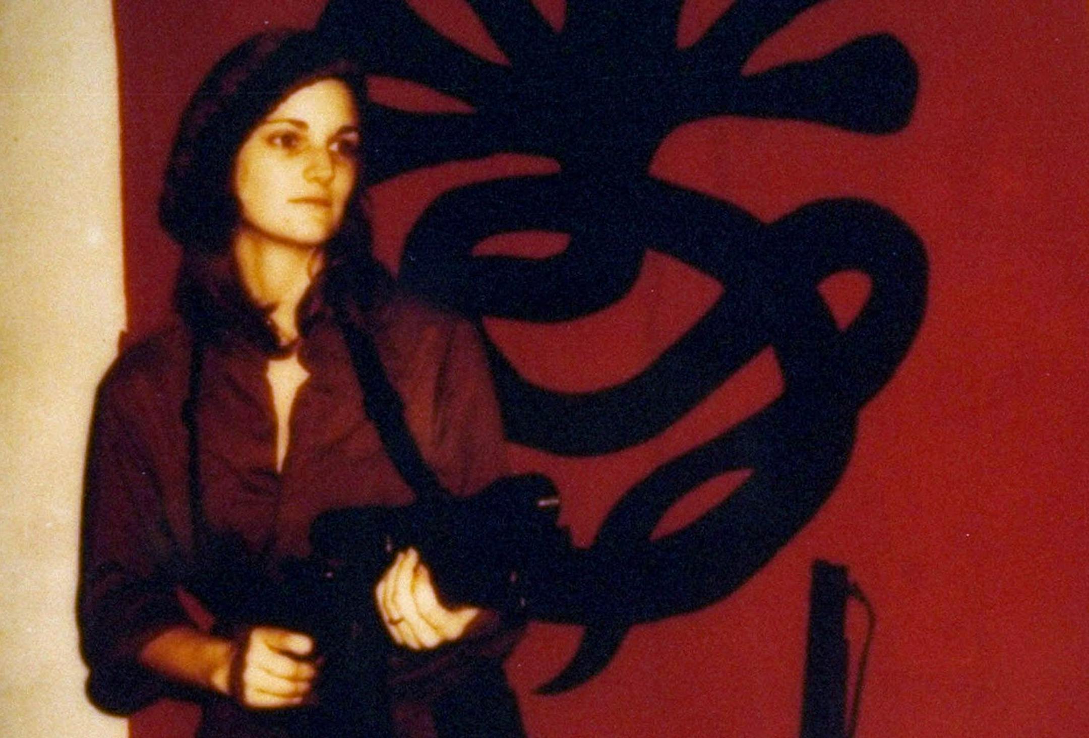 FILE--A poster issued by the Symbionese Liberation Army shows Patricia "Patty" Hearst, as "Tania" toting a machine gun in front of the terrorist group's symbol in this undated file photo. Kathleen Ann Soliah, the long-sought member of the SLA, was arrested Wednesday, June 16, 1999, 25 years after the group kidnapped newspaper heiress Patty Hearst and most of its members died in a shootout, the FBI said. (AP Photo, File)