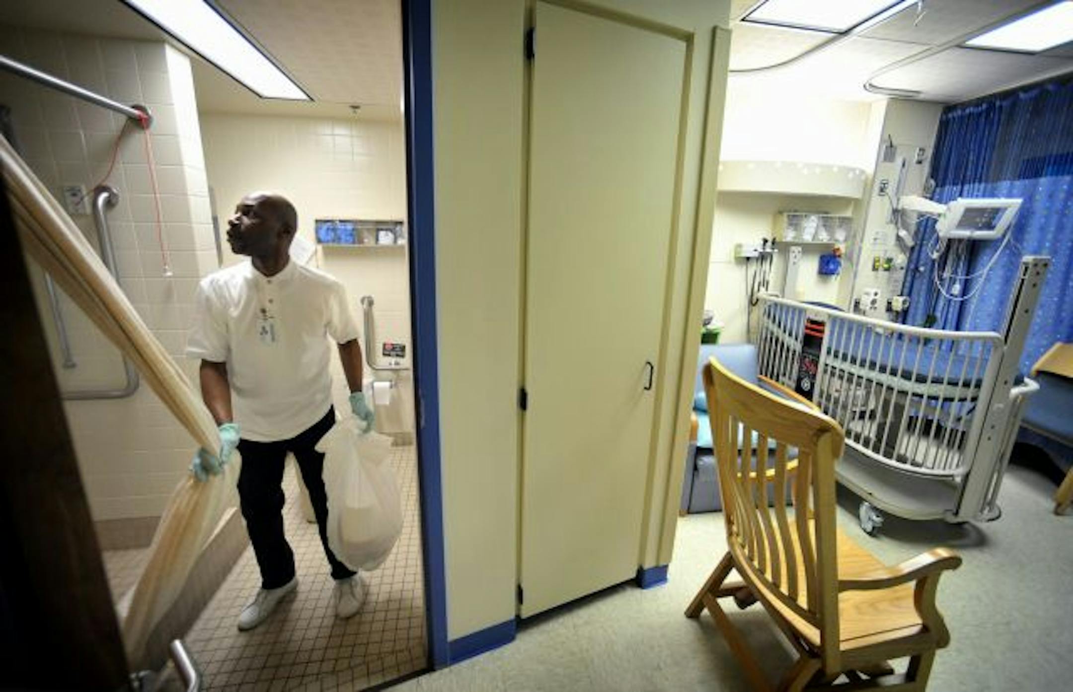 Custodian James Bunch cleaned and disinfected a patient room at University of Minnesota Amplatz Children's Hospital to get it ready for the next patient.