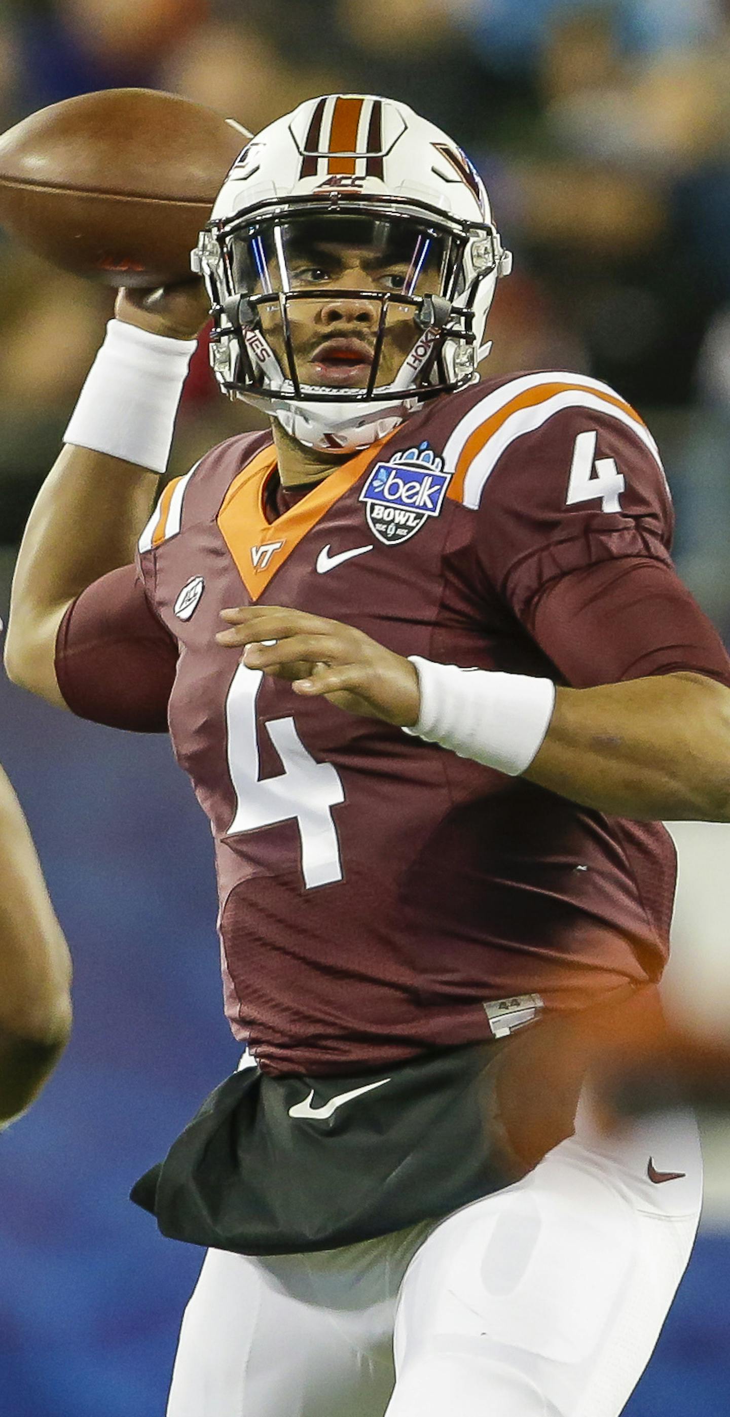 Virginia Tech's Jerod Evans (4) looks to pass as Arkansas's Jeremiah Ledbetter (55) applies the pressure during the first half of the Belk Bowl NCAA college football game in Charlotte, N.C., Thursday, Dec. 29, 2016. Virginia Tech won 35-24. (AP Photo/Bob Leverone) ORG XMIT: OTKBL110