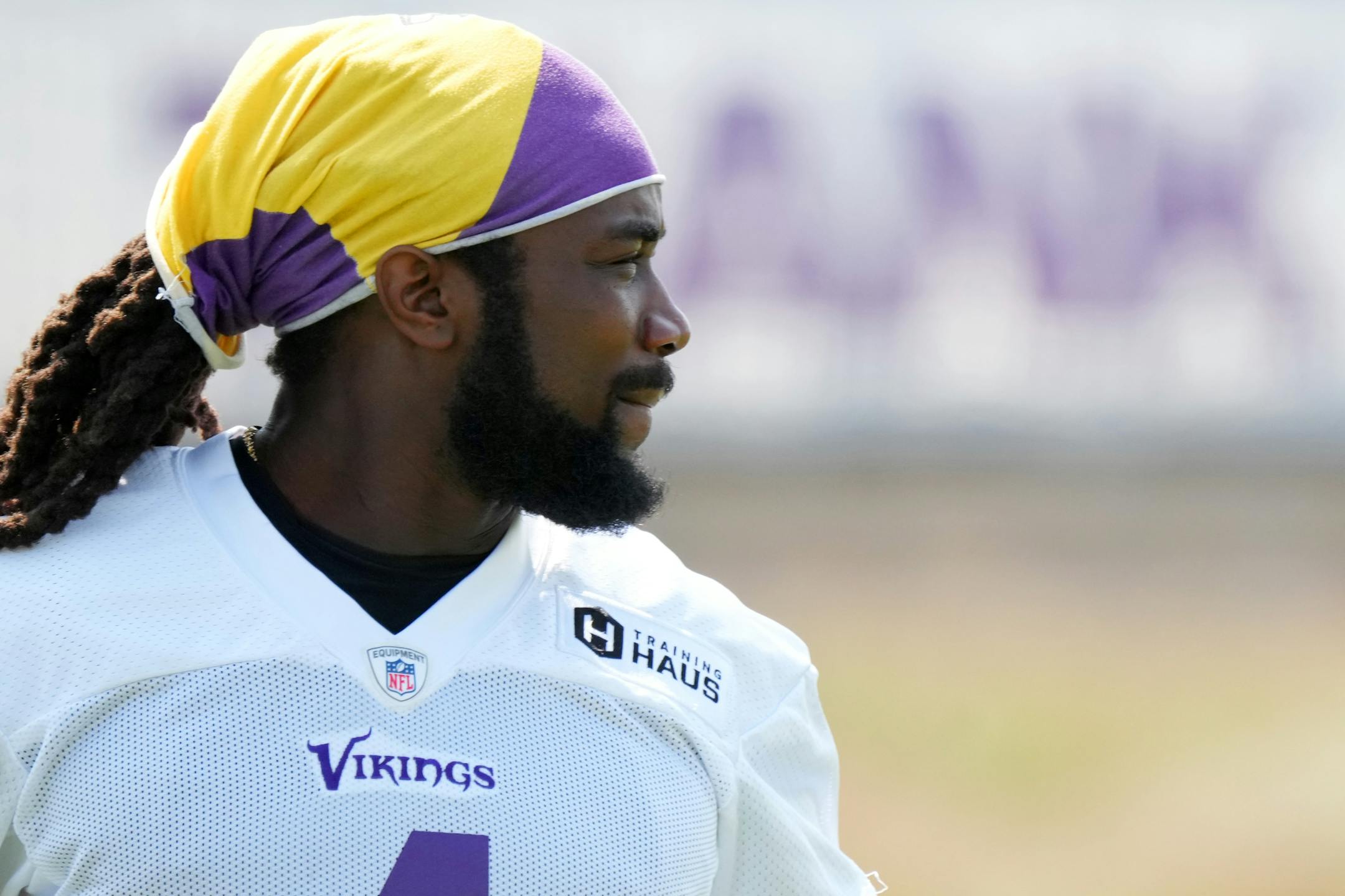 Minnesota Vikings running back Dalvin Cook (4) warms up with his teammates during training camp.