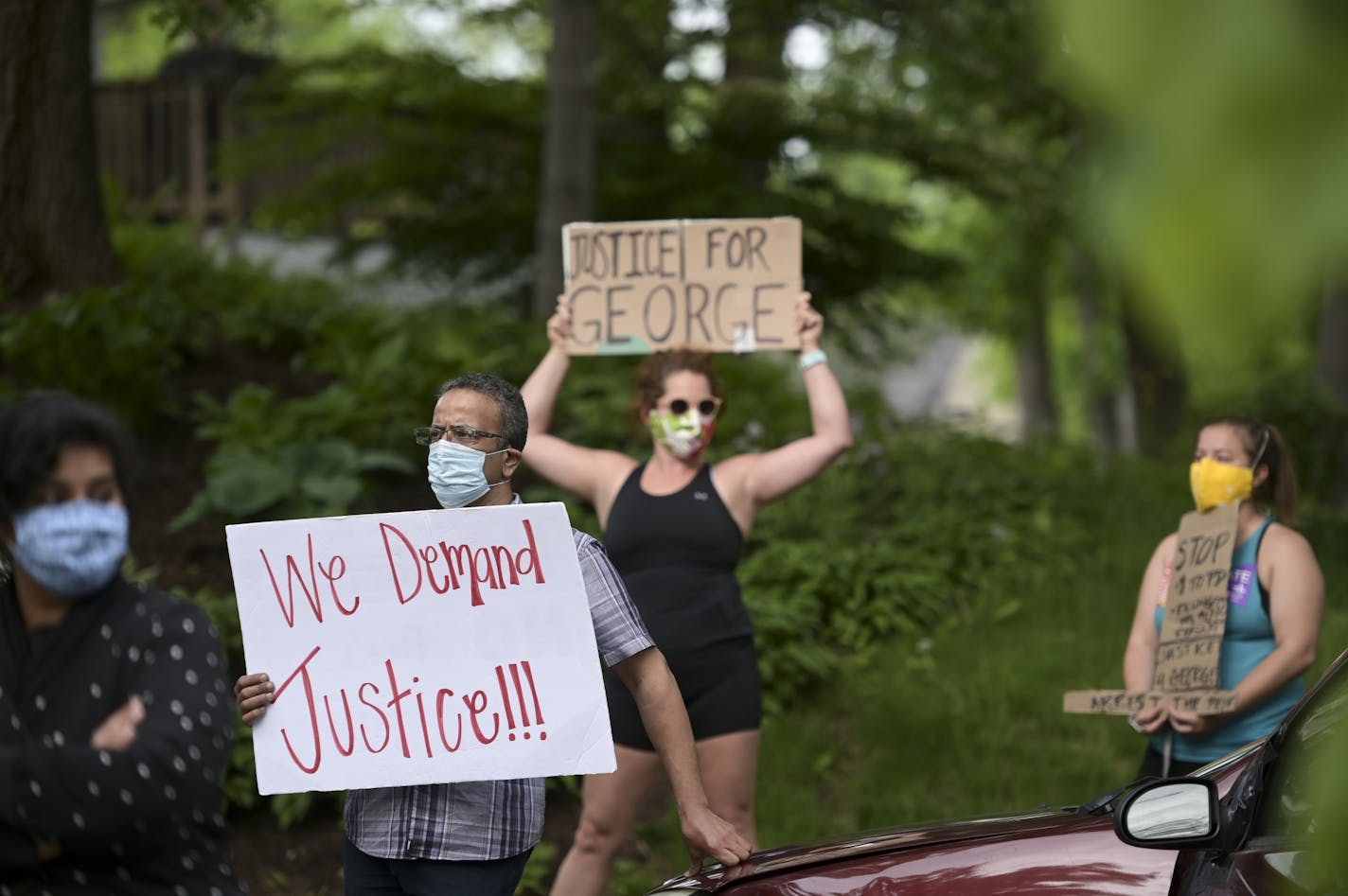 A few dozen protesters demanded justice for George Floyd outside the home of Hennepin County Attorney Mike Freeman Wednesday.