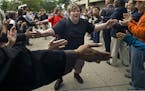 At South H.S. in Minneapolis, community members welcomed back students to the first day of school including Austin Burnett,17, who was excited to be g
