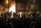 The Minneapolis Third Police Precinct station was set on fire during a third night of protests following the death of George Floyd while in Minneapoli