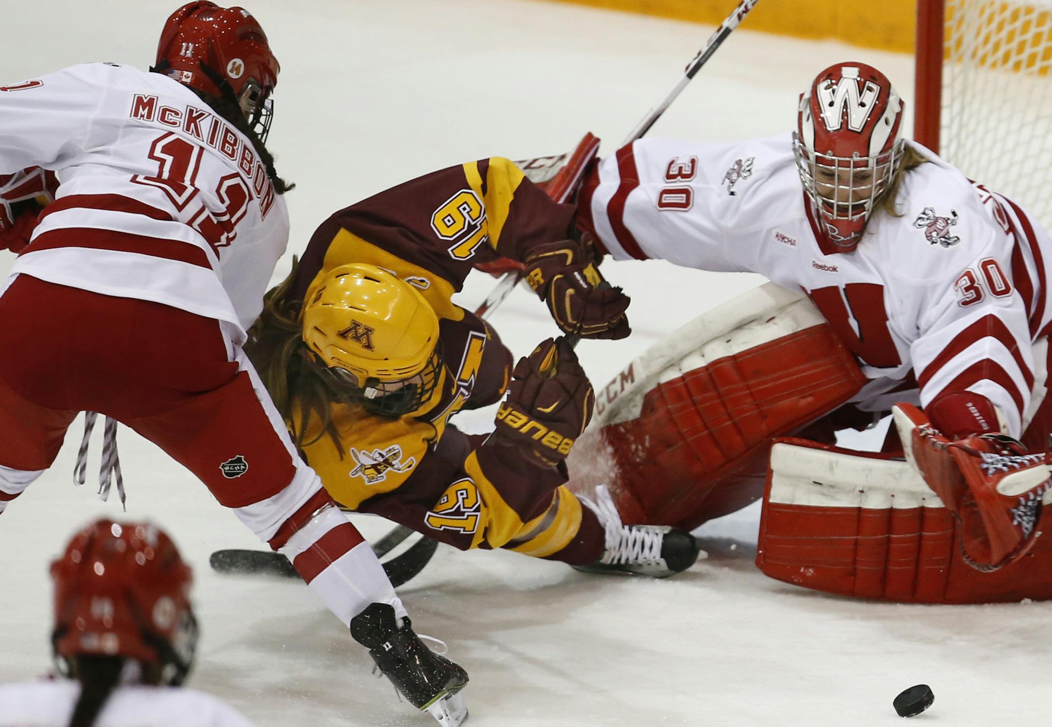 Kelly Pannek(19) crashed into Wisconsin goalie Ann-Renee Desbiens(30) during a game last season.