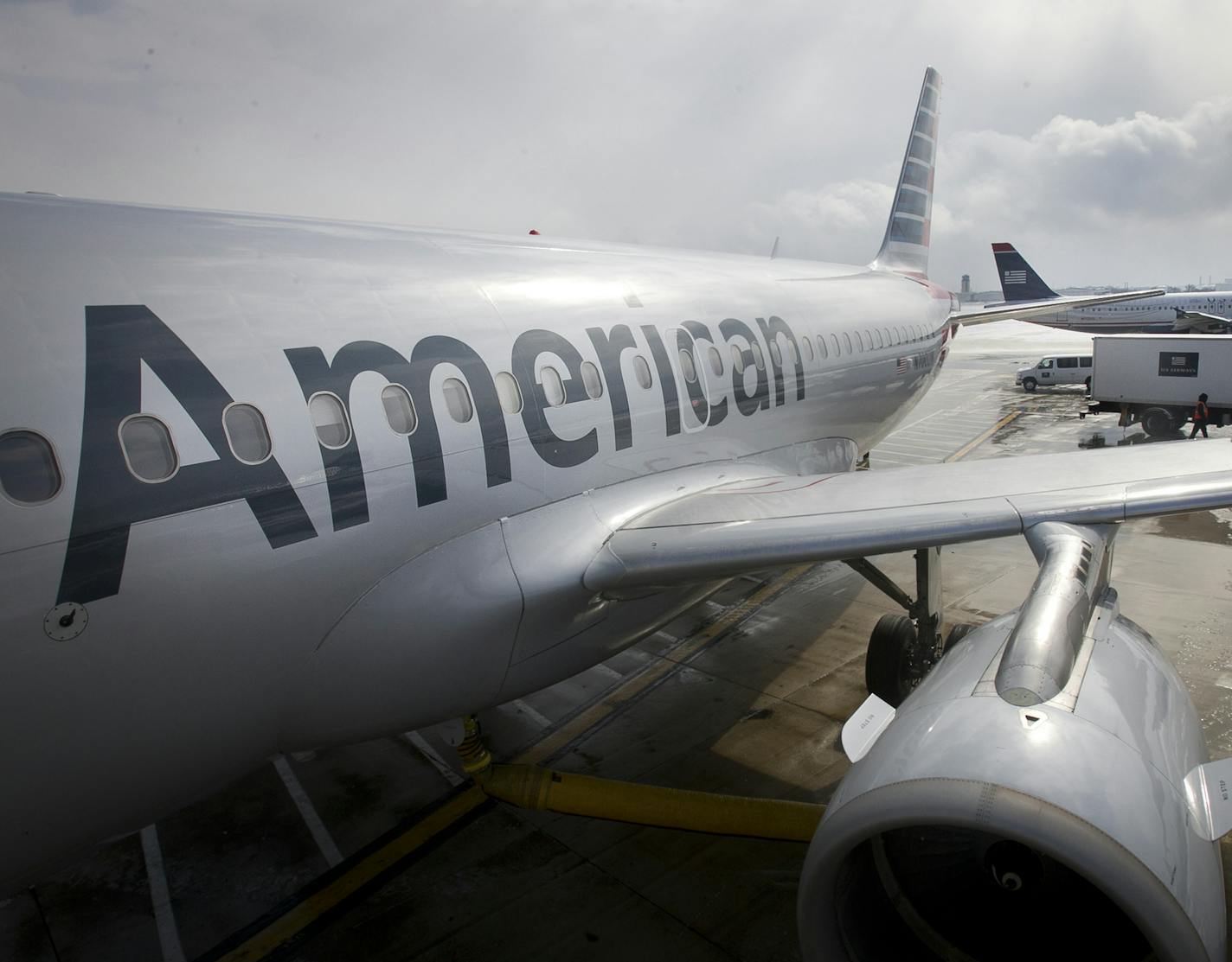 In this 2014 file photo, an American Airlines Airbus A319 is parked at a gate at Philadelphia International Airport.