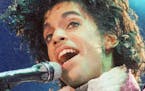 FILE - In this Feb. 18, 1985 file photo, Prince performs at the Forum in Inglewood, Calif. Prince, widely acclaimed as one of the most inventive and i