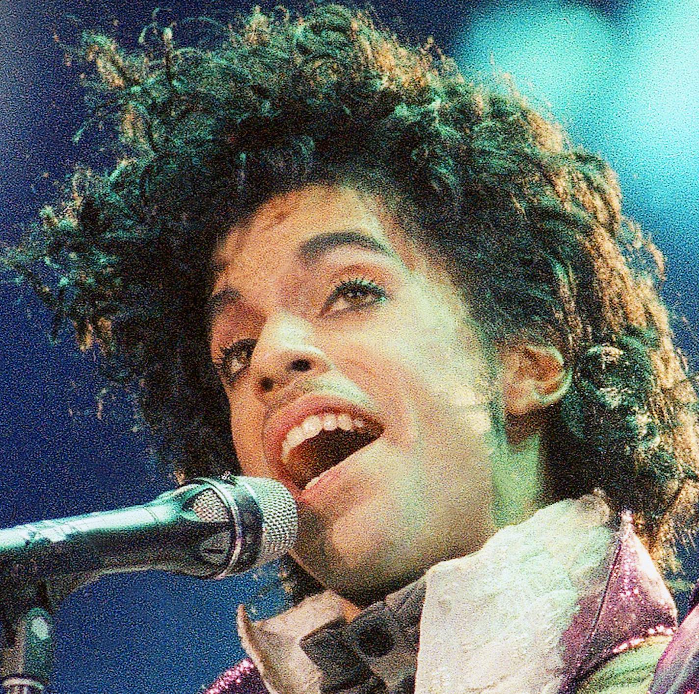 FILE - In this Feb. 18, 1985 file photo, Prince performs at the Forum in Inglewood, Calif. Prince, widely acclaimed as one of the most inventive and influential musicians of his era with hits including "Little Red Corvette," ''Let's Go Crazy" and "When Doves Cry," was found dead at his home on Thursday, April 21, 2016, in suburban Minneapolis, according to his publicist. He was 57. (AP Photo/Liu Heung Shing, File)