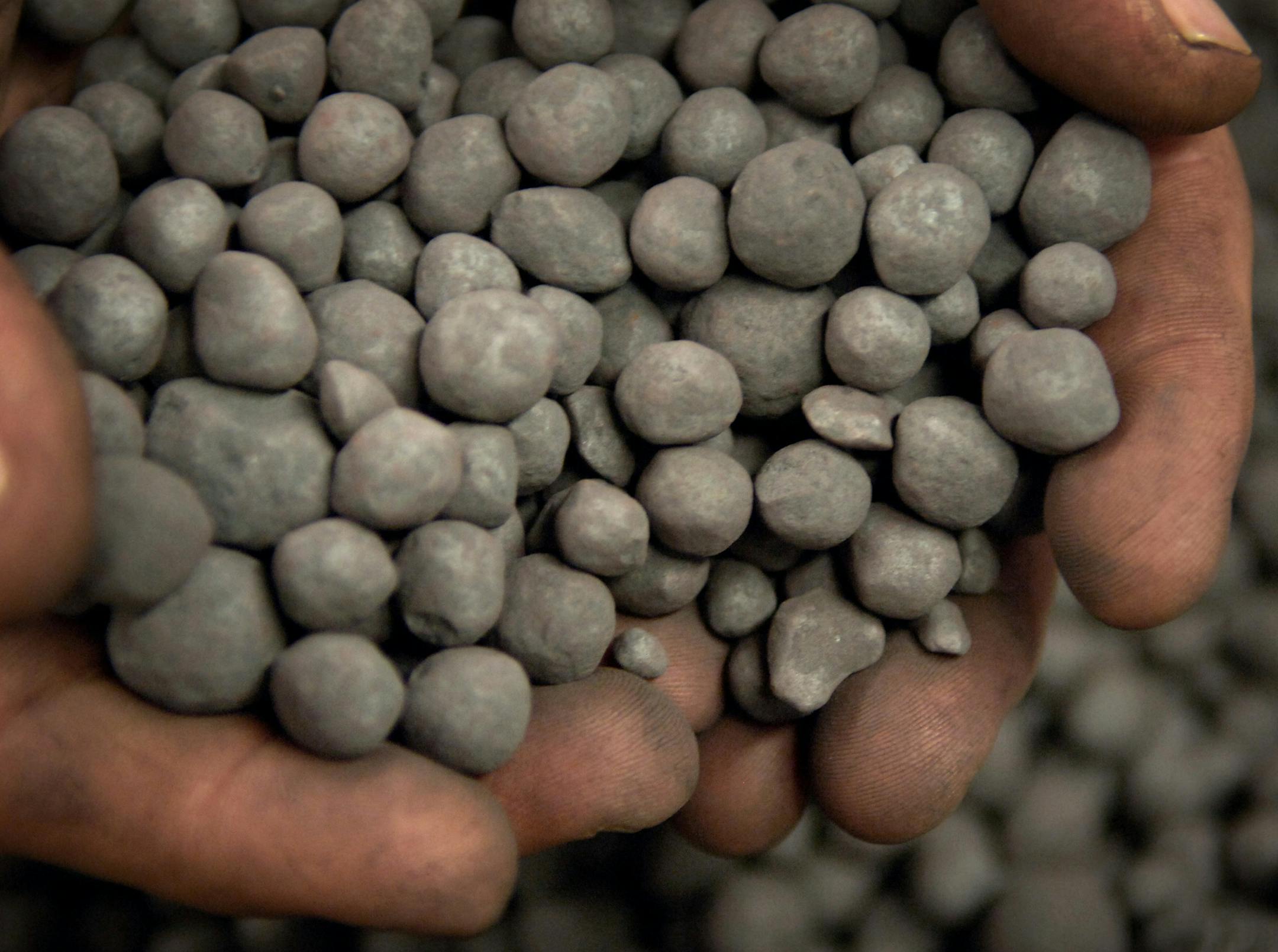 GLEN STUBBE ‘ gstubbe@startribune.com MONDAY, October 2, 2006 -- Forbes, Minn. -- United Taconite productivity coordinator Dave Hoglund scooped a handful of green taconite pellets which are then baked at 2,400 degrees, changing the structure of the ore from magnetic iron to hematite.