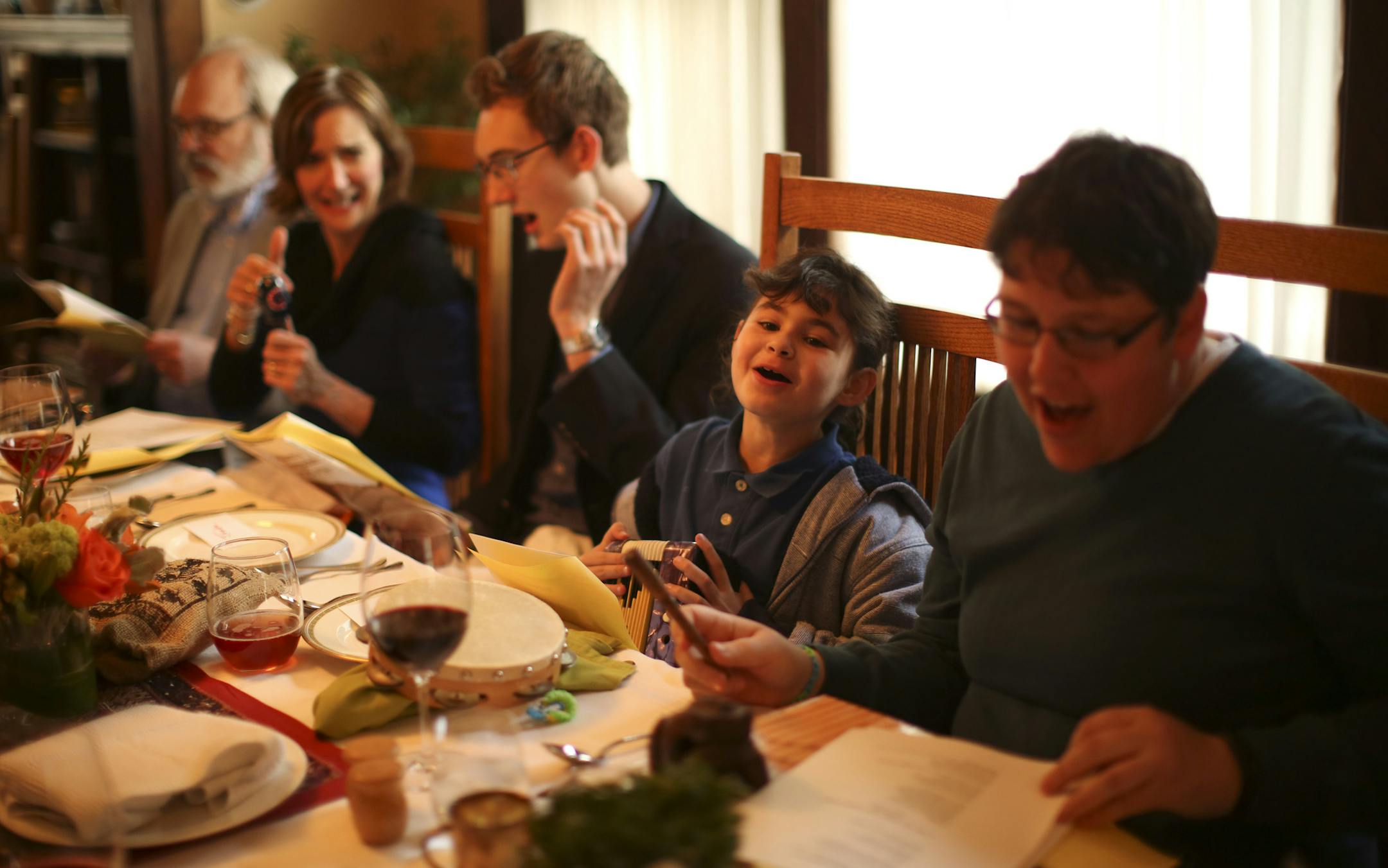The seder guests sang "Tonight" from West Side Story, with new lyrics relating to the Passover feast Monday evening. They are, from left, Ralph Campbell III, his wife, Katy Koch Campbell, their son Jack Campbell, Simone Pierotti, 9, and Theresa LaFavor. ] JEFF WHEELER ‚Ä¢ jeff.wheeler@startribune.com Kathryn Klibanoff and her husband, Jeremy Pierotti, hosted a musical seder they called "Passover on Broadway" Monday night, April 14, 2014 in their Minneapolis home. They followed t