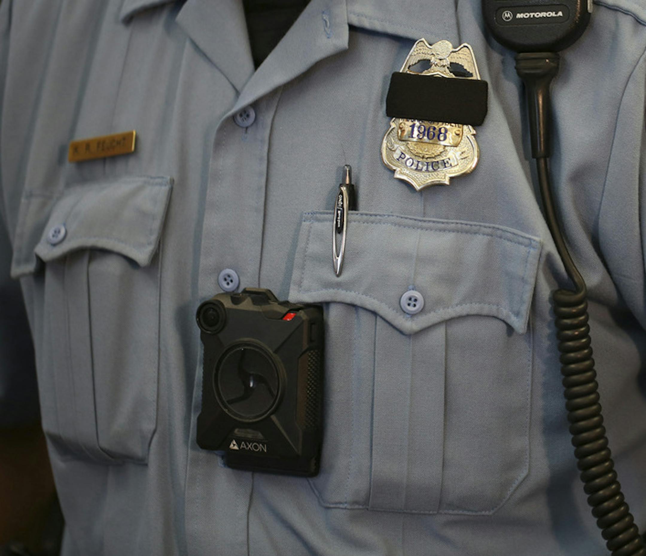 Minneapolis Police Officer Ken Feucht was one of the officers who volunteered for the body camera pilot program. He wore the Axon camera, made by Taser that will be used by the Minneapolis Police Department at the news conference at the First Precinct Police Headquarters Tuesday afternoon. ] JEFF WHEELER • jeff.wheeler@startribune.com Mayor Betsy Hodges and Police Chief Jane Harteau announced at a news conference Tuesday afternoon, July 19, 2016 that Minneapolis Police Department's Body C