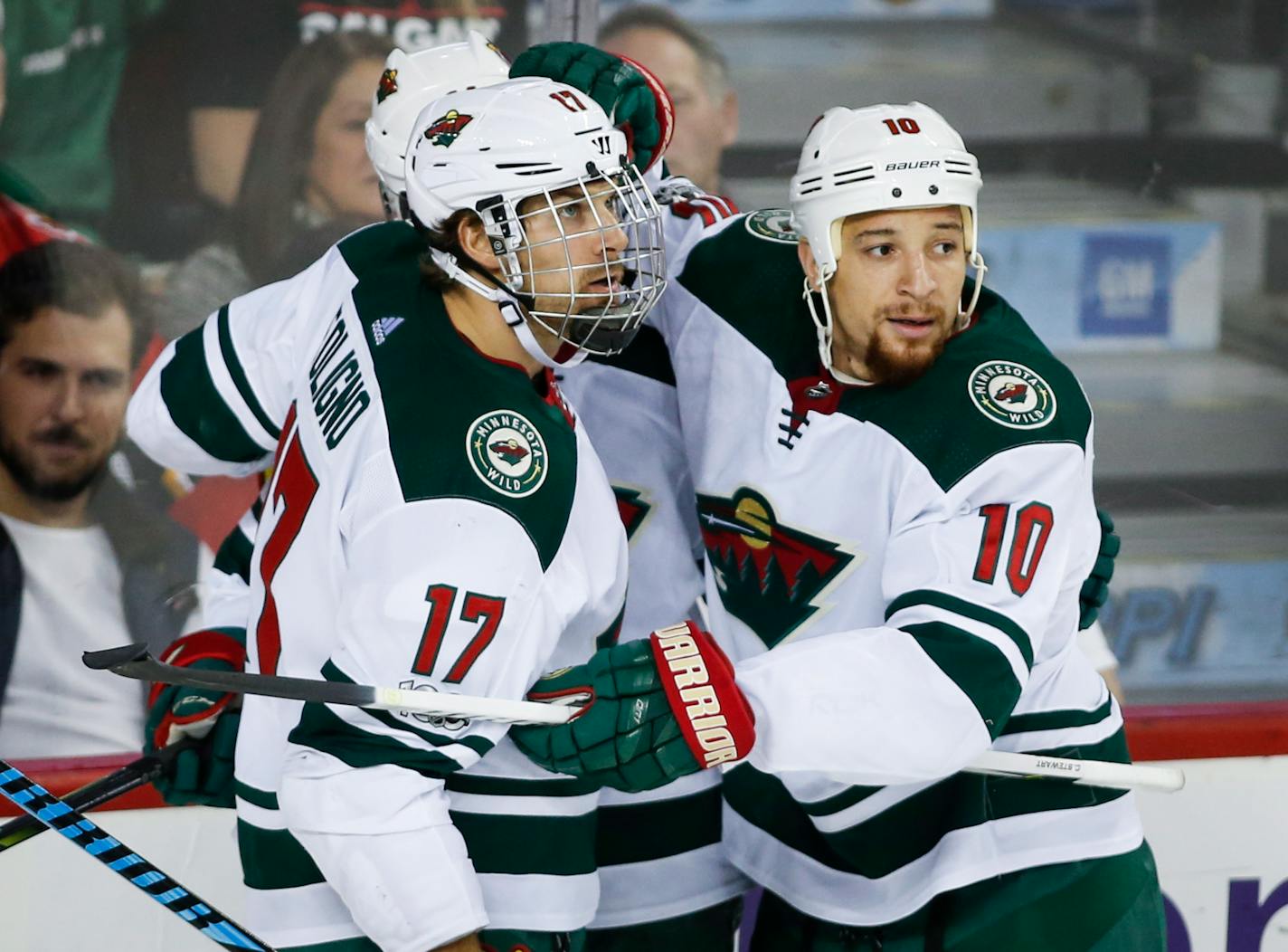 Minnesota Wild's Chris Stewart, right, celebrates his goal with teammate Marcus Foligno during the second period of an NHL hockey game against the Calgary Flames on Saturday, Oct. 21, 2017, in Calgary, Alberta. (Jeff McIntosh/The Canadian Press via AP)