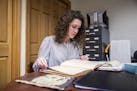 Angelina Lincoln looks at material in the archives of the St. Thomas of Villanova monastery on Tuesday, Feb. 18, 2020. Villanova graduate student Linc