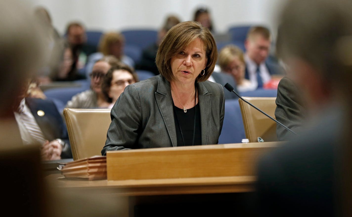 In this April 24, 2018 photo, Mona Dohman, commissioner of public safety, testifies on opioid abuse during a hearing before a Minnesota Senate committee on finance in St. Paul, Minn. At least 16 states are considering a tax on prescription painkillers that are blamed for starting an overdose epidemic that claims tens of thousands of American lives a year. Most of the bills would funnel the revenue into addiction treatment and prevention programs. (AP Photo/Jim Mone)