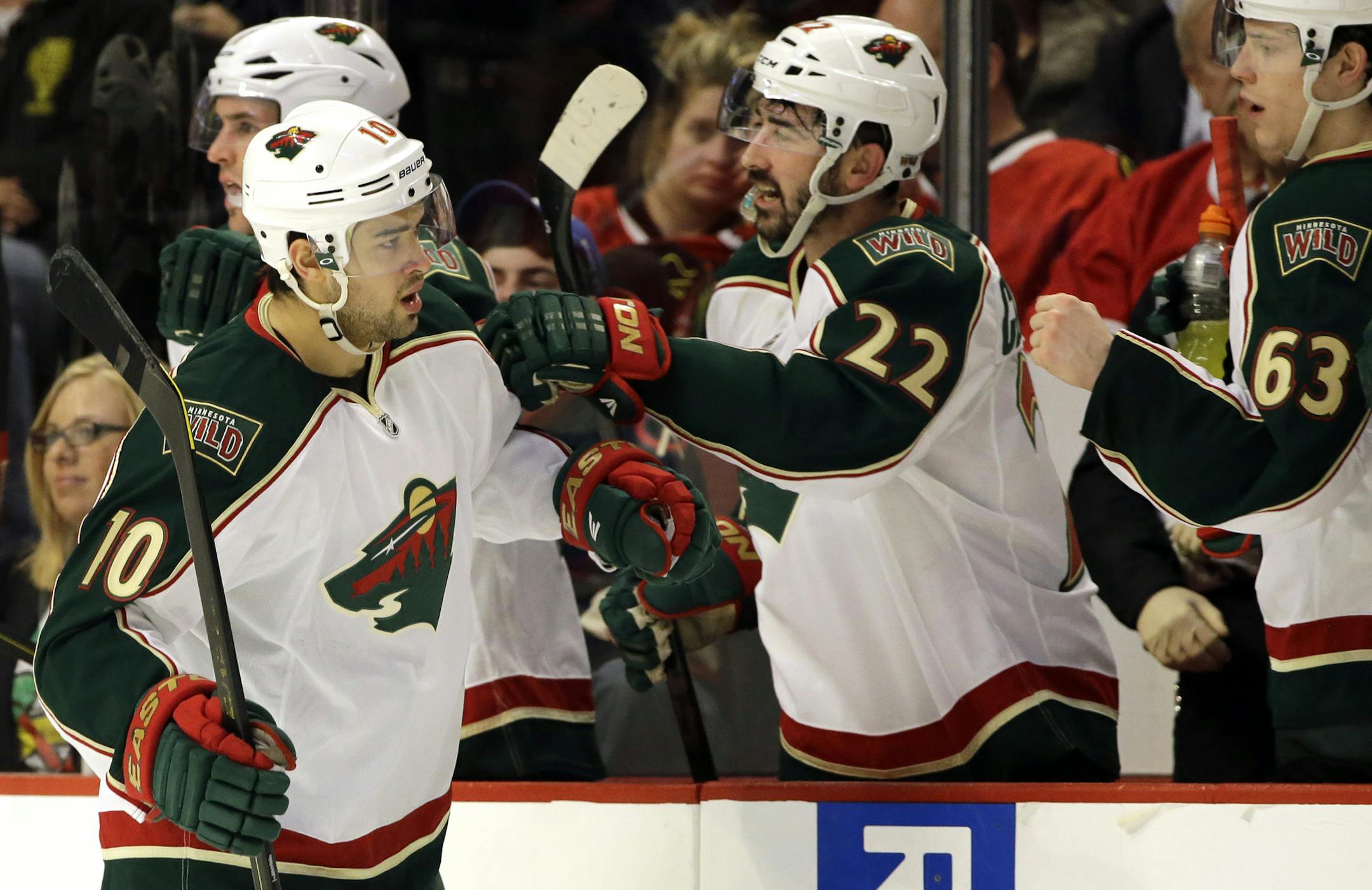 Minnesota Wild's Devin Setoguchi (10) celebrates with teammates after scoring a goal against the Chicago Blackhawks during the second period of Game 2 of an NHL hockey Stanley Cup first-round playoff series in Chicago, Friday, May 3, 2013. (AP Photo/Nam Y. Huh)