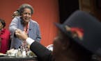 Myrlie Evers-Williams, civil rights activist and widow of slain civil rights leader Medgar Evers, shook hands with Gazell Pettway after giving the key