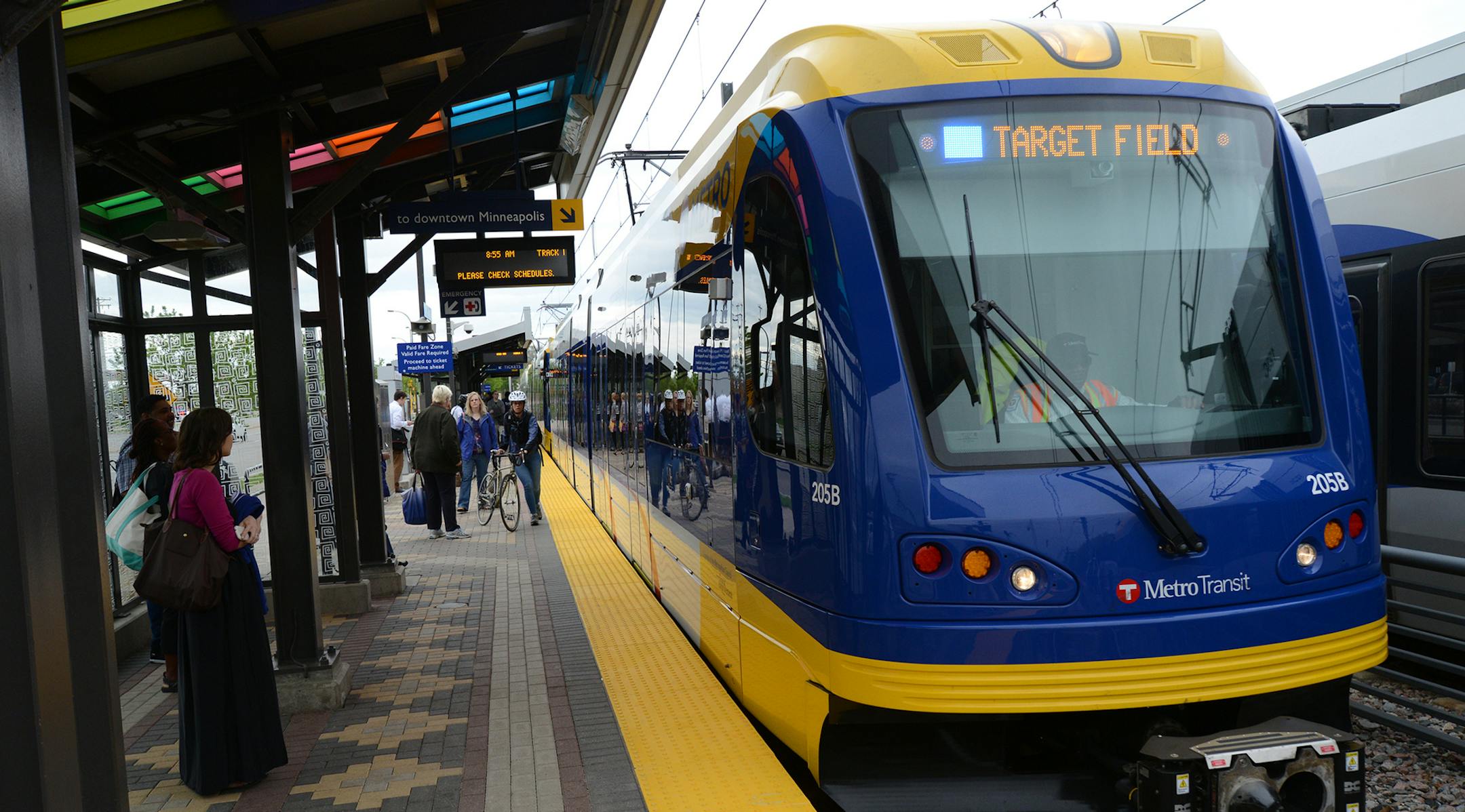 The Hiawatha Light Rail Line is being rebranded as the METRO Blue Line. The Blue Line is the first of the Twin Cities METRO system of rapid transit lines which include METRO Red Line Bus Rapid Transit on Cedar Ave. METRO Blue Line trains will now have three cars and will run every ten minutes throughout most of the day. Twelve new light-rail vehicles dedicated to the line will allow this increased service capacity. During the kickoff event Metro Transit staff handed out Blue line pens, new sched