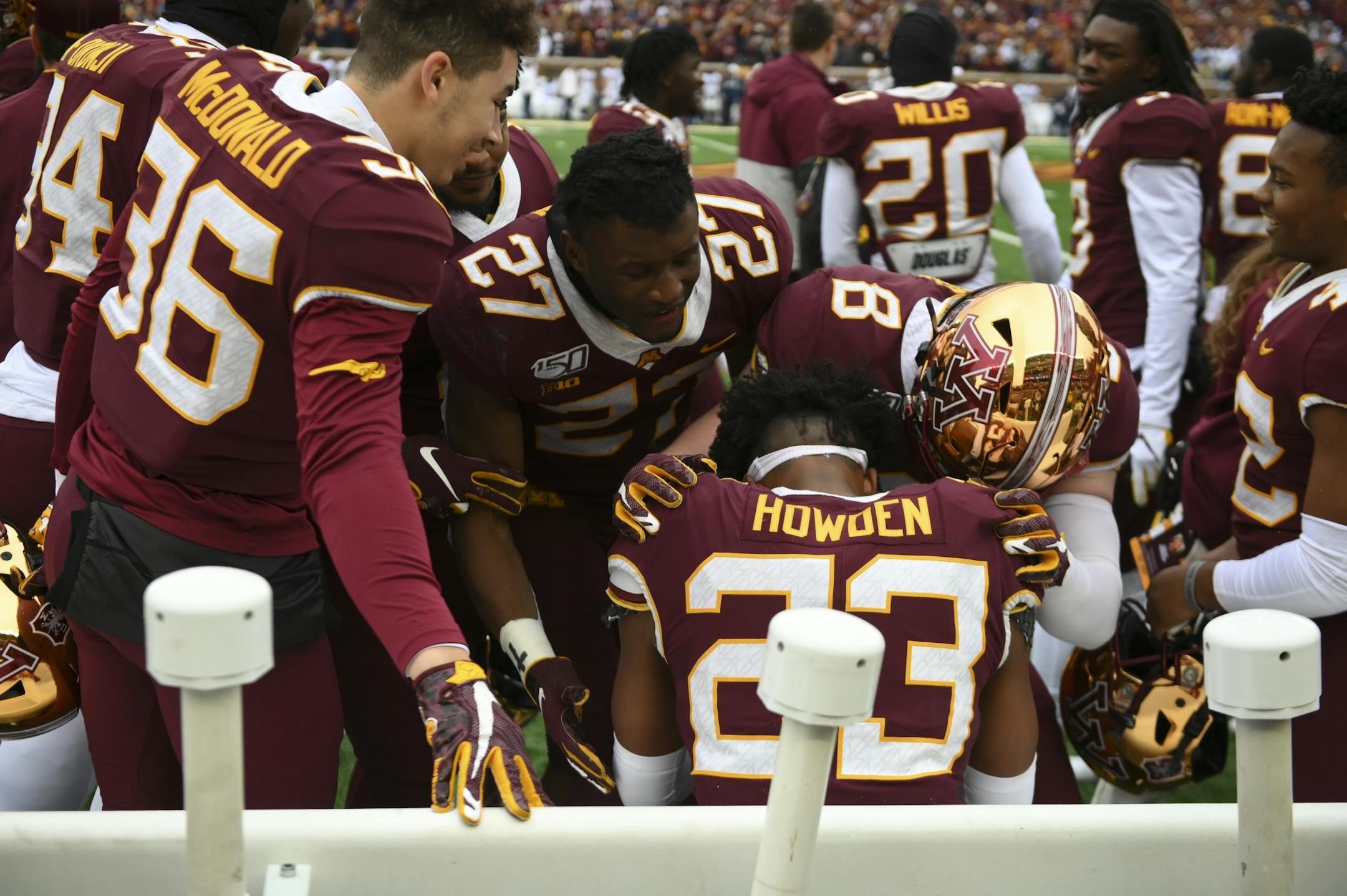 Teammates surrounded Minnesota Gophers defensive back Jordan Howden (23) after his game-winning interception Saturday.