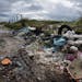FILE -- In this Nov. 18, 2013 photo, rubbish is piled up on the edge of cultivated land near Caivano, in the surroundings of Naples, southern Italy. A