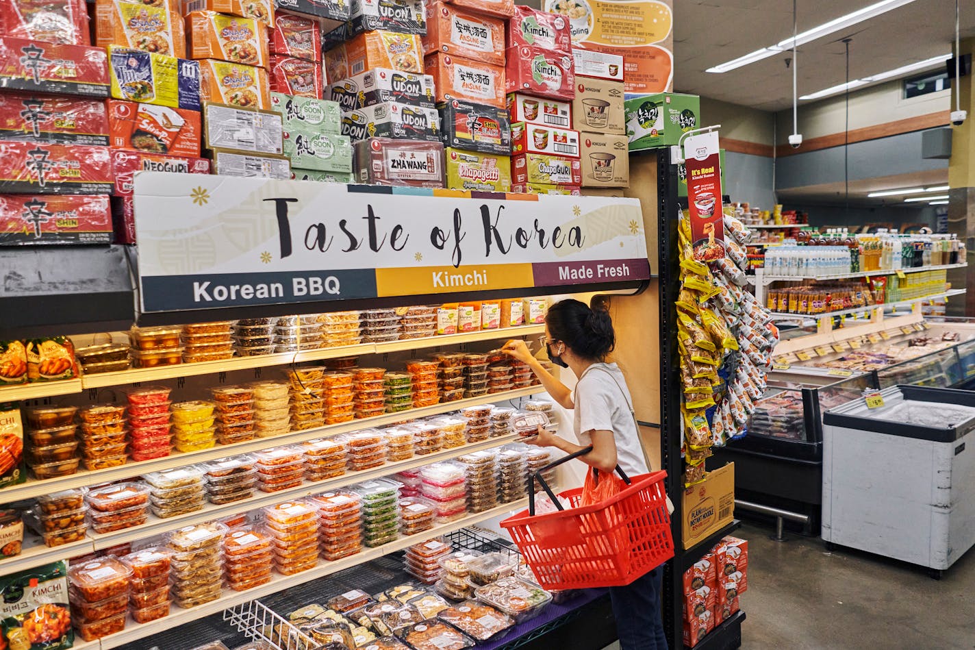 An ethnic food aisle at Food Bazaar, which has sections dedicated to specific countries in Brooklyn, on July 24, 2021. This international hodgepodge strikes many shoppers and food purveyors as antiquated but doing away with it isn't as easy as it might sound. (An Rong Xu/The New York Times)