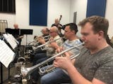 Genesis Jazz Orchestra will perform a mix of contemporary jazz and freshened standards Wednesday at the Rosemount Central Park Amphitheater.