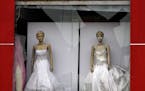 A bridal boutique damaged a day after a car bombing hit the eastern neighborhood of New Baghdad, Iraq, Wednesday, July 22, 2015. On late Tuesday a car