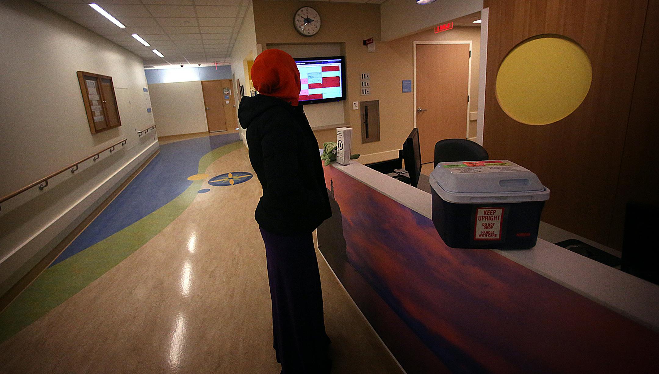 A lab assistant delivered the blood cells to the hospital. ] (JIM GEHRZ/STAR TRIBUNE) / April 23, 2013 / 12:00 PM Minneapolis, MN ‚Äì BACKGROUND INFORMATION- A child who was born with the HIV virus, received an experimental treatment in his hospital room at the University of Minnesota. It may look like he's simply getting fluids from an IV bag, but he's getting cord blood cells from a donor with a genetic resistance to HIV infection. Doctors hope that the blood cell transplant w