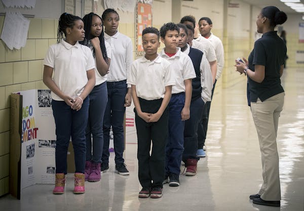 Students at Marcus Garvey Elementary School are required to line up in the hall way to prevent disruption, Tuesday, March 21, 2017 in Chicago, IL.