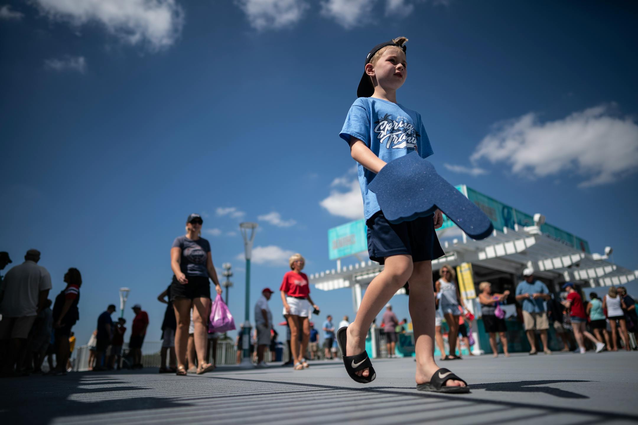 Landon Degree, 7 and his mom Kristi Degree (at left), residents of theTwin Cities, enjoyed the hot sunny weather Saturday at Hammond Stadium.