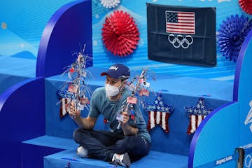 American figure skater Jason Brown poses for a photograph on the Team USA bench on Thursday. 