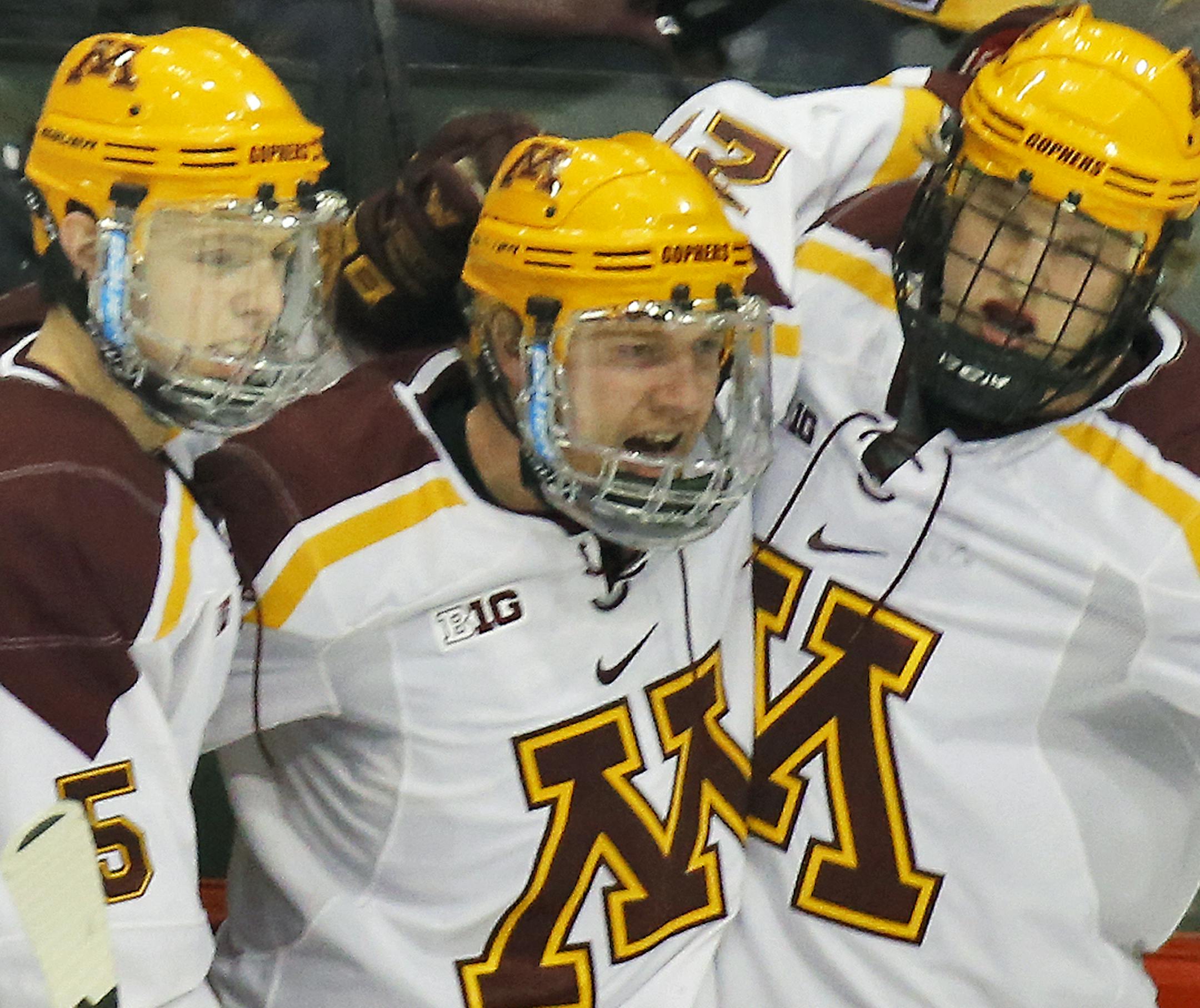 Minnesota Gophers vs. St. Cloud State University (SCSU). Minnesota players celebrated a goal by Travis Boyd, center, in first period action. (MARLIN LEVISON/STARTRIBUNE(mlevison@startribune.com)
