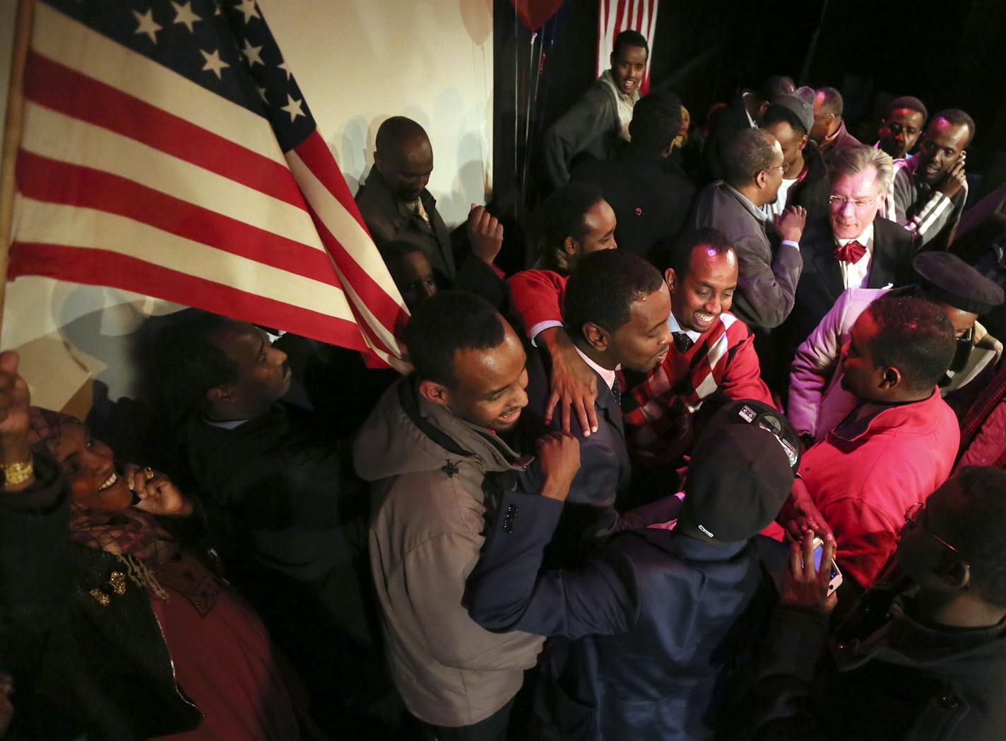 Following preliminary results that showed him winning in several wards, Ward 6 City Council candidate Abdi Warsame is surrounded by supporters at the Mixed Blood Theatre Tuesday, Nov. 5, 2013, in Minneapolis, MN.](DAVID JOLES/STARTRIBUNE) djoles@startribune.com Minneapolis City Council race: Should know the results of some, including in Ward 6, where Abdi Warsame could win, becoming the highest elected Somali in the country. ORG XMIT: MIN1311052236588085