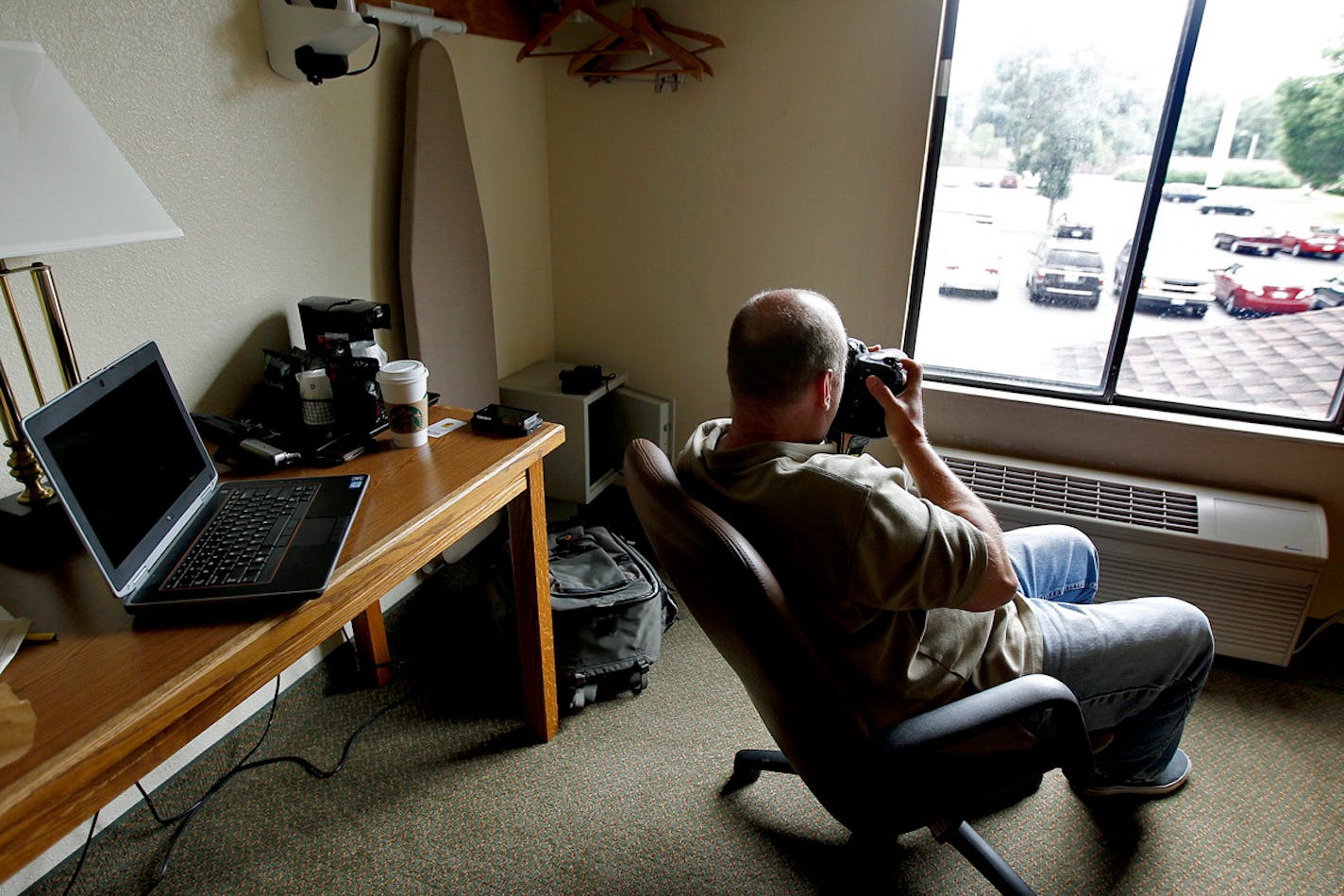 FILE -- Minneapolis police Sgt. Grant Snyder photographed parking lot activity from a hotel room during a stakeout on an alleged sex-trafficking case in 2013.