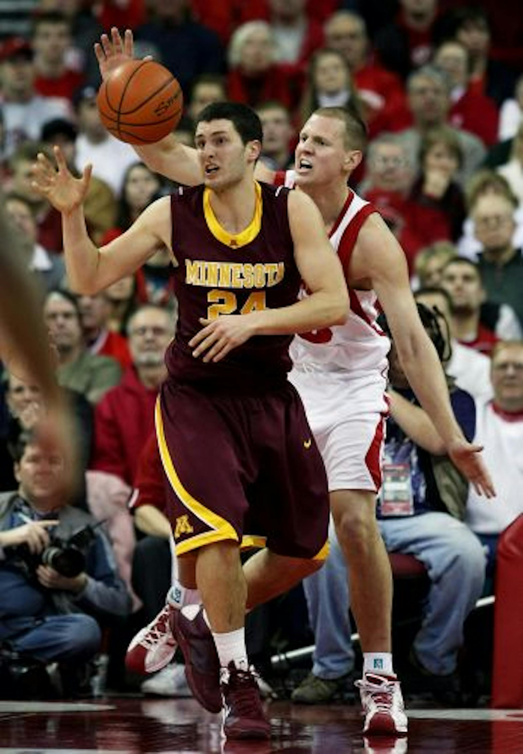 MADISON, WI - JANUARY 15: Blake Hoffarber #24 of the Minnesota Golden Gophers tries to control the ball under pressure from Kevin Gullikson #43 of the Wisconsin Badgers at the Kohl Center January 15, 2009 in Madison, Wisconsin. Minnesota defeated Wisconsin 78-74 in overtime.