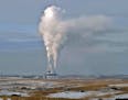 In this Jan. 30, 2008, file photo, steam rises from the Milton Young Power Plant near Center, N.D.