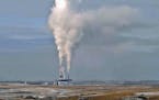 In this Jan. 30, 2008, file photo, steam rises from the Milton Young Power Plant near Center, N.D.