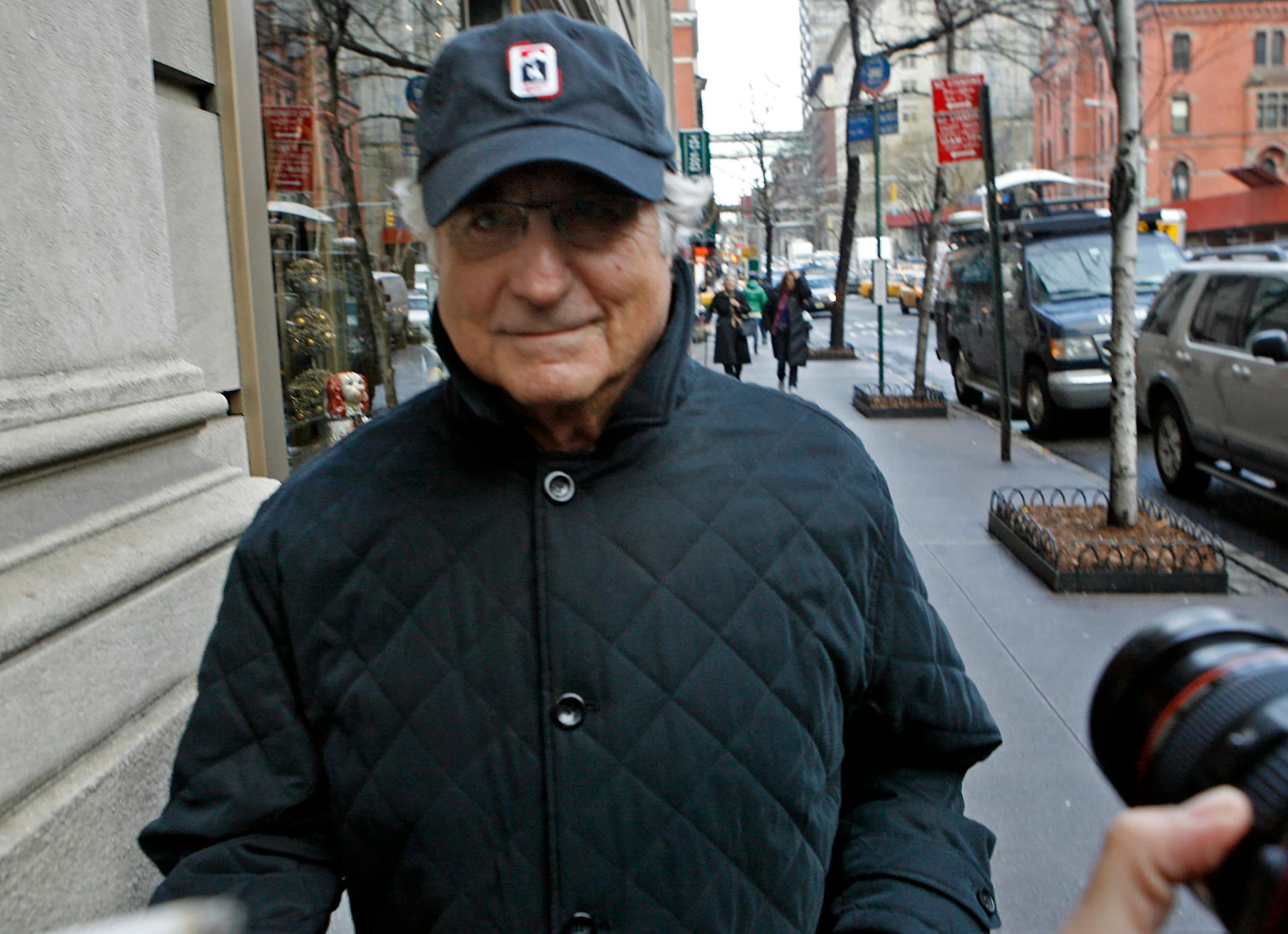 Bernard Madoff, chairman of Madoff Investment Securities, returns to his Manhattan apartment after making a court appearance Wednesday, Dec. 17, 2008 in New York. The judge in Madoff's fraud case has set new conditions for his bail, including a curfew and ankle-monitoring bracelet for the disgraced investor.