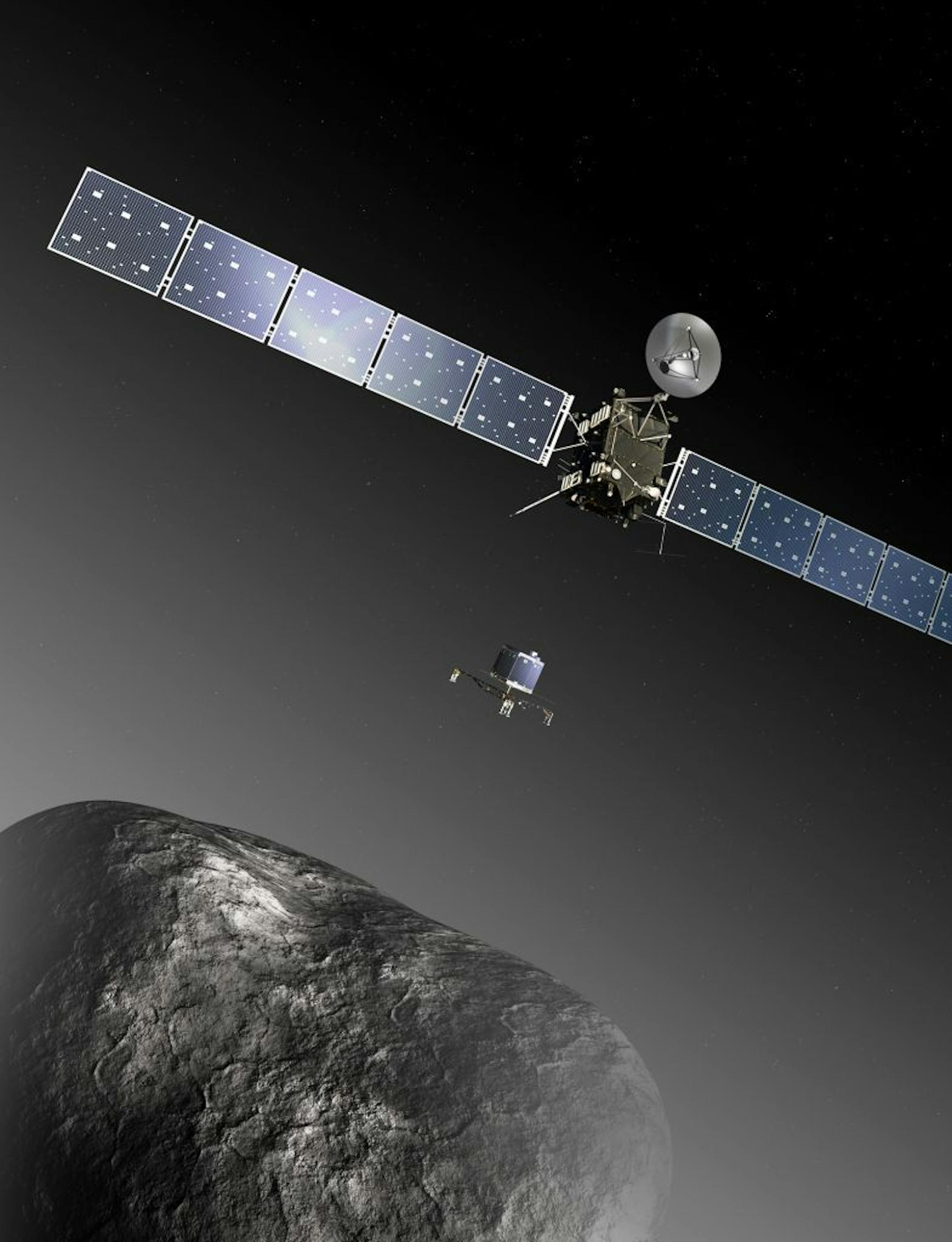 FILE - This image provided by the European Space Agency ESA shows an artist�s impression of the Rosetta orbiter deploying the Philae lander to comet 67P/Churyumov�Gerasimenko. The image is not to scale; the Rosetta spacecraft measures 32 m across including the solar arrays, while the comet nucleus is thought to be about 4 km wide.