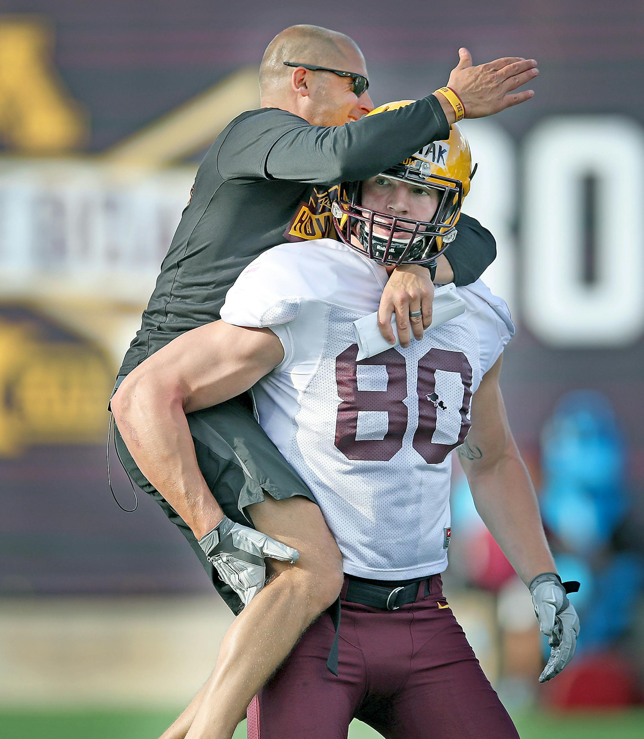 Gophers Head Coach P.J. Fleck jumped on Nate Wozniak during after a play during the Gophers football practice at Gibson-Nagurski Football Complex, Friday, August 4, 2017 in Minneapolis, MN. ] ELIZABETH FLORES ï liz.flores@startribune.com